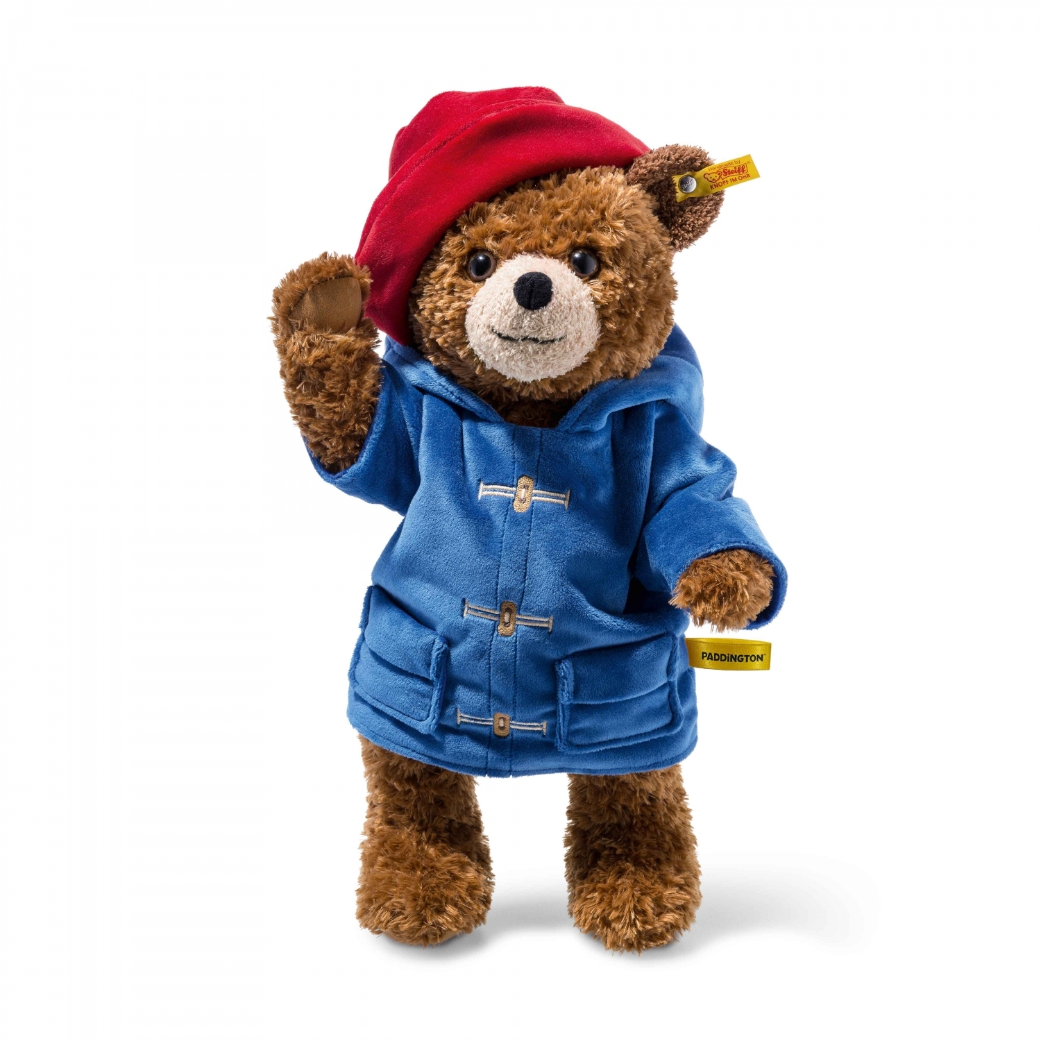 Reden Lionel Green Street Klagen Beertje Paddington van Steiff heeft een blauwe jas en een rode hoed.